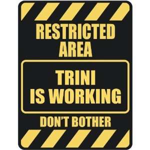   RESTRICTED AREA TRINI IS WORKING  PARKING SIGN: Home 