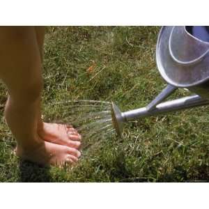  Watering Can Sprinkling Water on Childs Feet Photos To Go 