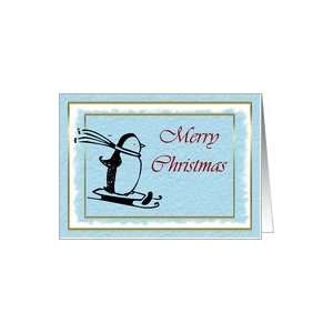 Merry Christmas with skiing penguin on blue snow background Card