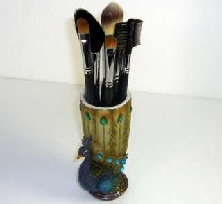   watching a very cute Mini Peacock Make up brush/pen Stand holder