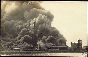 suriname (?), Oil Refinery on Fire, Church (1930s) RPPC  