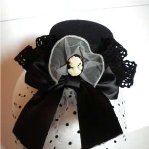   Mini Top Hat with Large Black Bow and Polka Dot Veil 