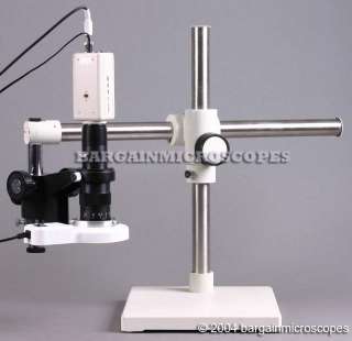 Boom stand mounted stereoscopic microscope.