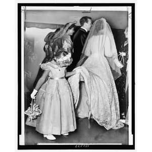   girl,Margaret Peel,looking up brides dress,1954