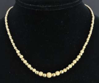   is a stylish Italian bead necklace crafted from solid 14K yellow gold