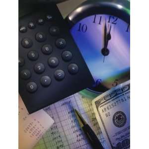  Calculator Over Clock, Spread Sheet and Money Stretched 