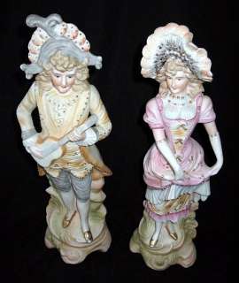Sign Japan PAULUX Colonial Couple figurines, 13 1/4h  